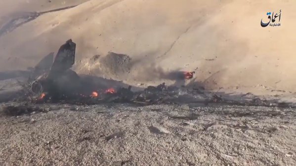 Video by Aamaq showing wreckage of MiG-23 SAA jet downed by ISIS south Deir Ezzor. Pilot killed. Syria  