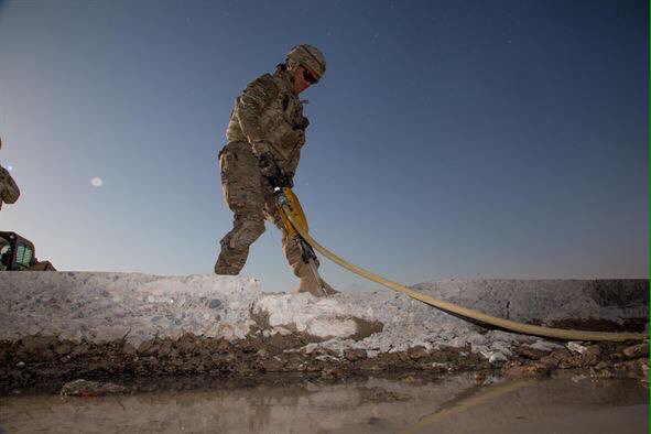 US soldiers working to rebuild the Qayyarah air base south of Mosul  