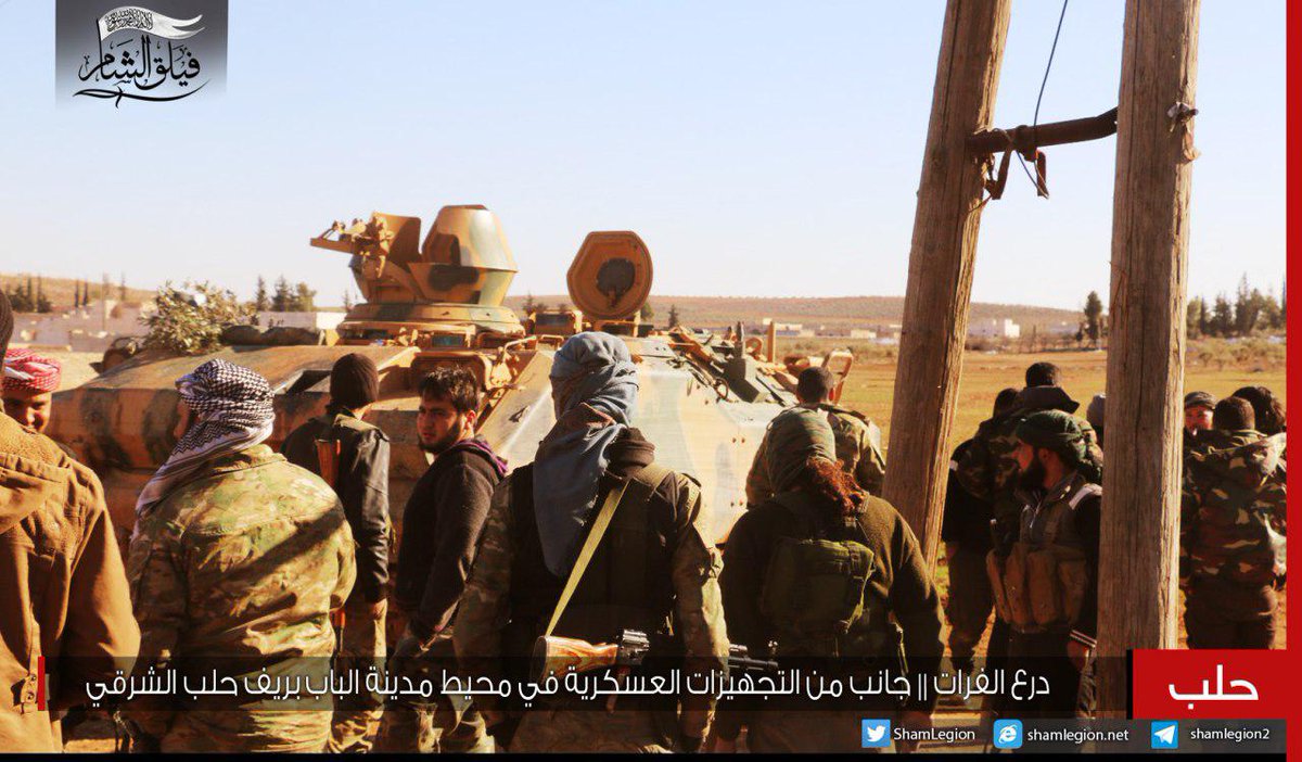 Faylaq Al-Sham fighters in Al-Bab area showing a downed ISIS quadcopter drone (Dji Dhantom model)  and  ACV-15