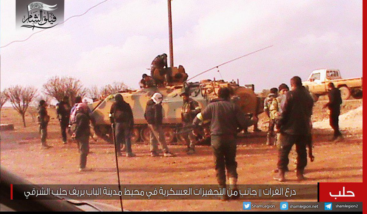 Faylaq Al-Sham fighters in Al-Bab area showing a downed ISIS quadcopter drone (Dji Dhantom model)  and  ACV-15