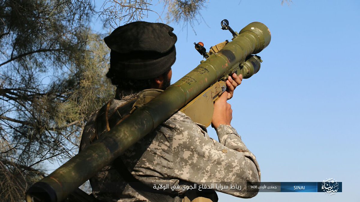 Egypt: ISIS/Sinai Province photo with its Air Defense Unit on guard duty showing off a 9K32/Strela-2 (replica?)  and AA gun equipped technical  