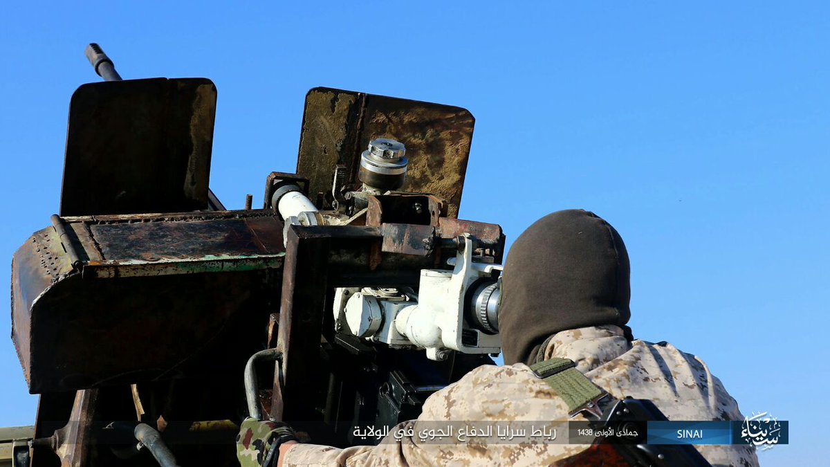 Egypt: ISIS/Sinai Province photo with its Air Defense Unit on guard duty showing off a 9K32/Strela-2 (replica?)  and AA gun equipped technical  