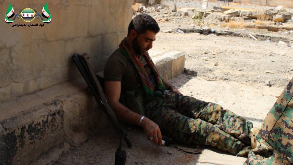 Fighters from the Northern Democratic Brigade and Jabhat al-Akrad resting after clashes with ISIS in Raqqa city  