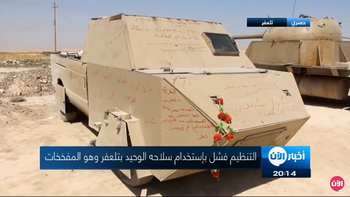 Two up-armored tan 4x4 SVBIEDs captured in Tal Afar area displayed together with T-55 truck captured a week ago  