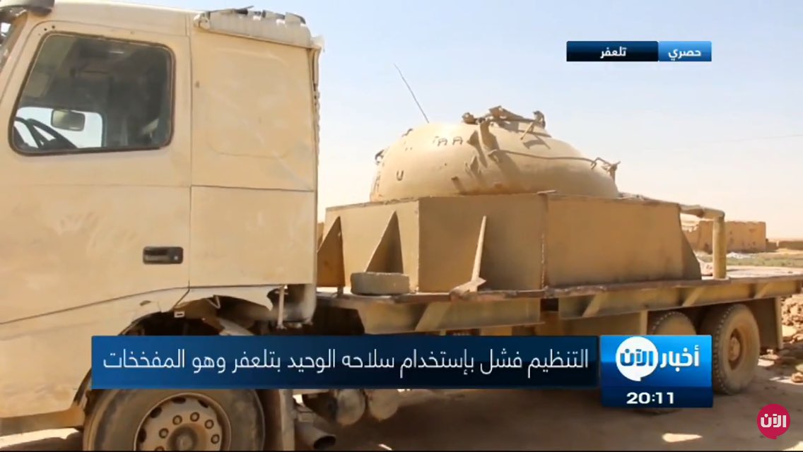 Two up-armored tan 4x4 SVBIEDs captured in Tal Afar area displayed together with T-55 truck captured a week ago  
