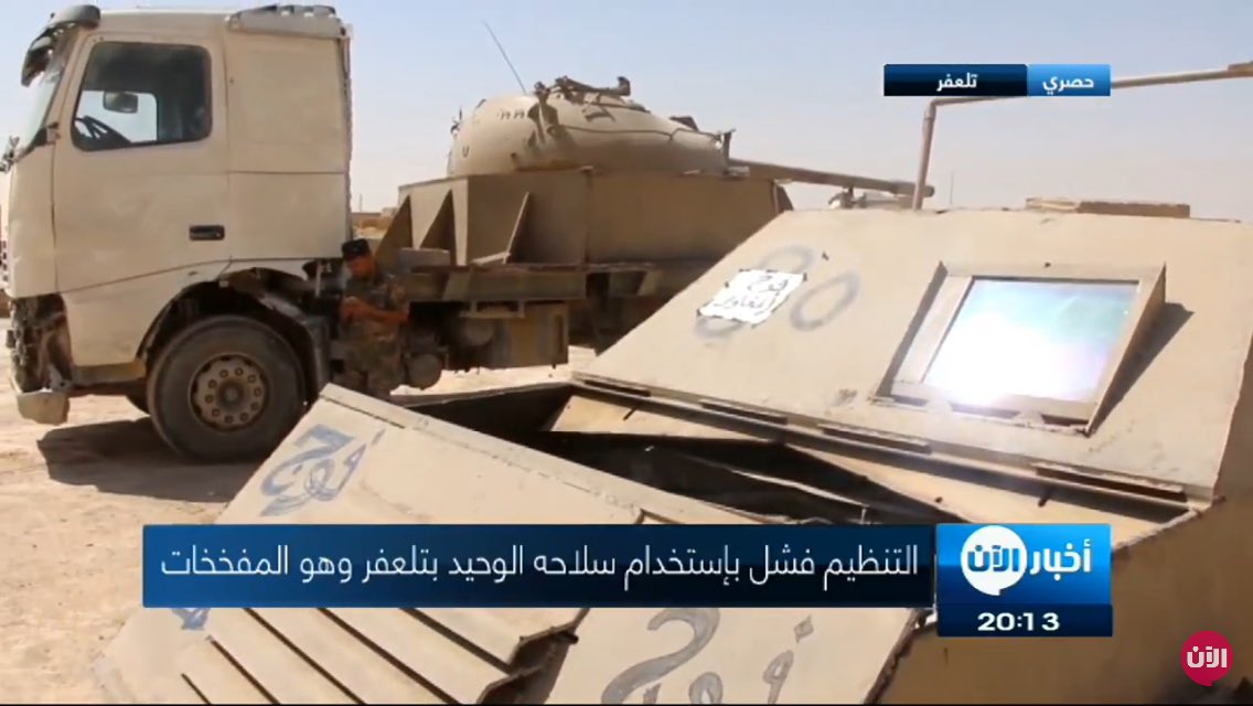 Two up-armored tan 4x4 SVBIEDs captured in Tal Afar area displayed together with T-55 truck captured a week ago  